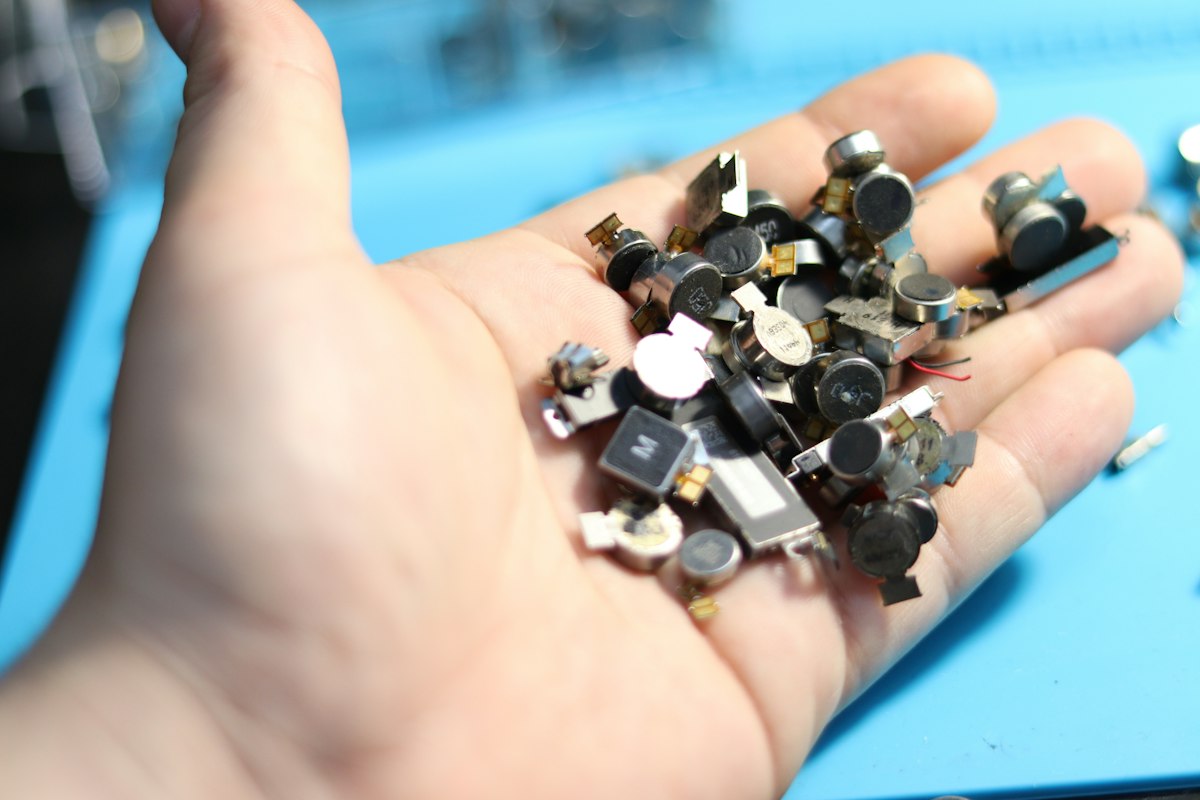 Handful of electronic components for recycling