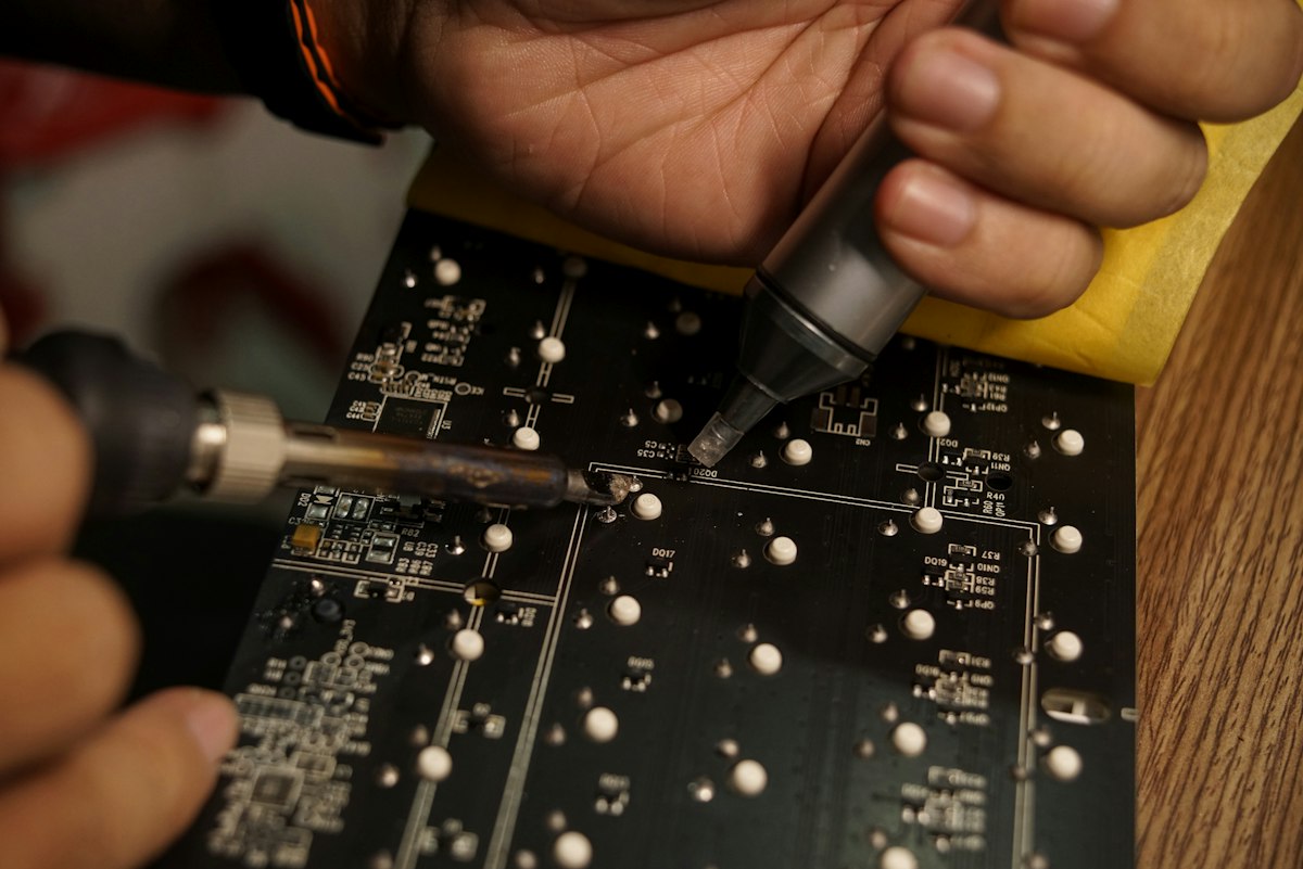 Technician working on a circuit board